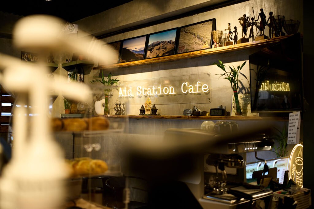 aid station cafe glowing banner
